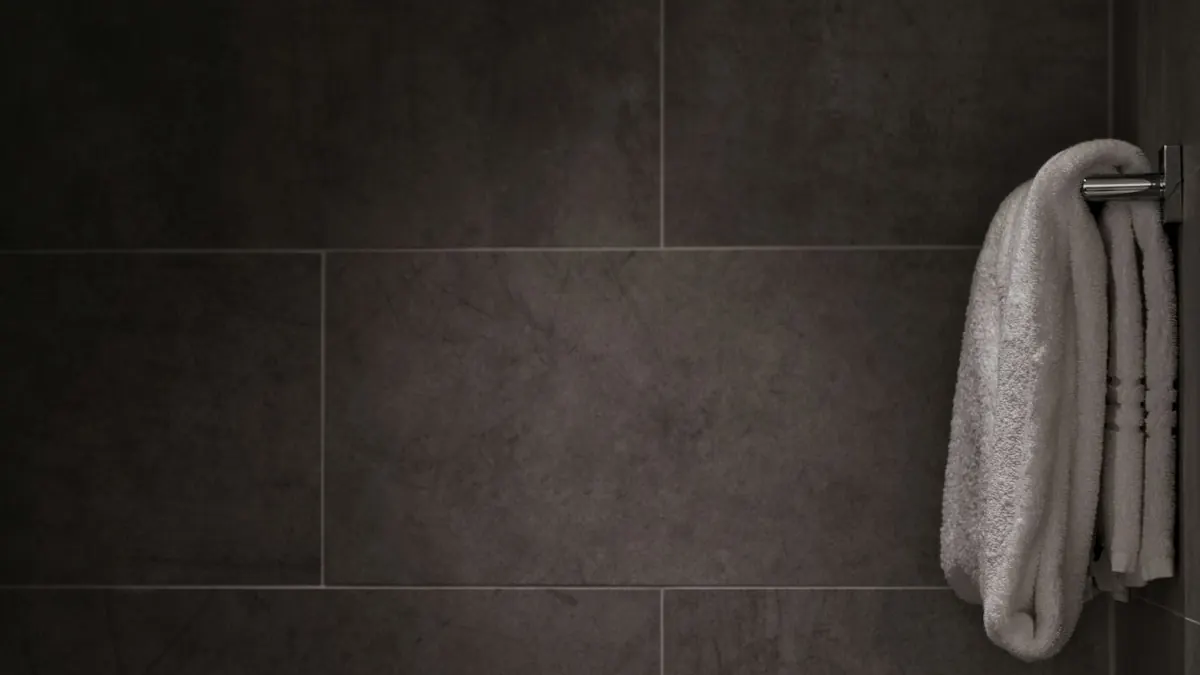 Side by side view of porcelain tile and wood-look luxury vinyl plank flooring in a remodeled Massachusetts kitchen