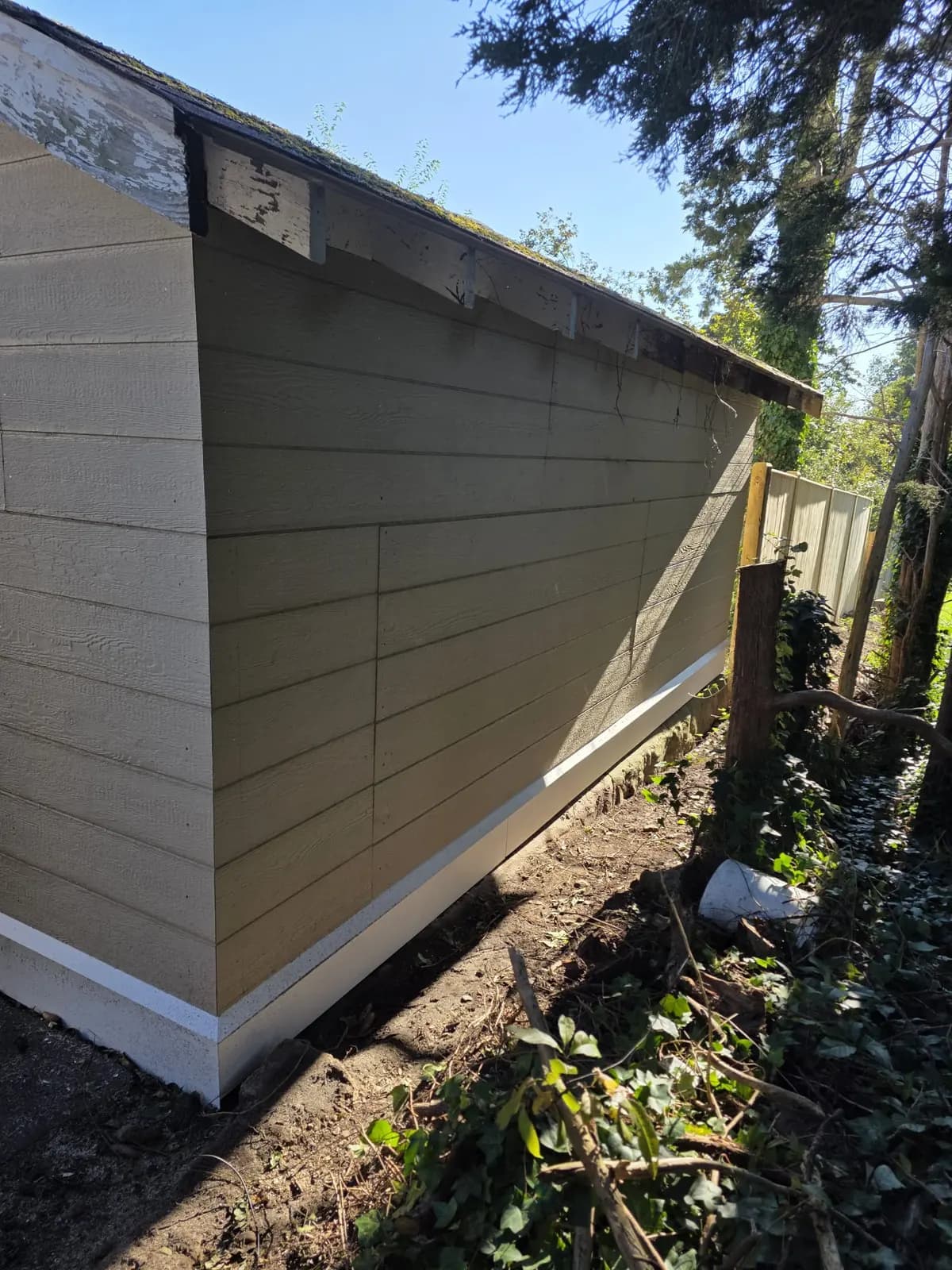 Garage side wall with new siding and base trim