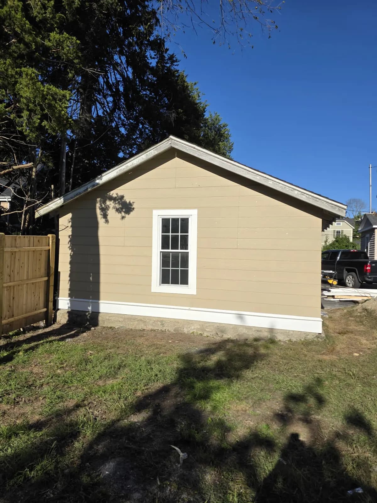 Garage rear wall with new siding around the window