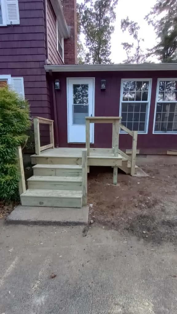 New wood entry steps with railing built by WS Construction